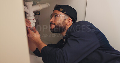 Buy stock photo Plumber, man and pipe inspection in kitchen with safety for home maintenance or fixing leak by sink. Plumbing contractor, handyman and working on filter system improvement for small business in house