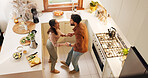 Couple, home and dancing in kitchen with music for love, bonding and meal prep with fruit. Above, people and relationship with happiness or smile for healthy food, nutrition and diet with fun