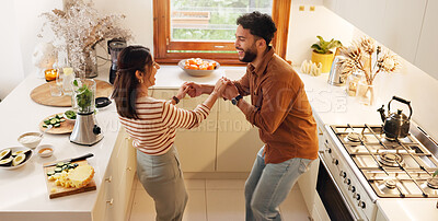 Buy stock photo Couple, home and dancing in kitchen with music for love, bonding and meal prep with fruit. House, people and relationship with happiness or smile for healthy food, nutrition and diet with fun