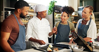 Buy stock photo Cooking, course and chef teaching group in kitchen for knife skills, cutting technique and knowledge. Culinary class, people and mentor with learning on onion preparation and education in hospitality