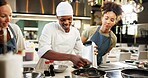 Cooking, class and chef in kitchen with women for meal preparation, teaching gourmet recipe and learning skills. Culinary course, students or mentor with lesson on food education or cuisine knowledge