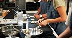 Hands, cooking and meal prep in kitchen, chef and group in hospitality, food and planning in restaurant. Menu, fine dining and people with skills, ingredients and service for cuisine and culinary