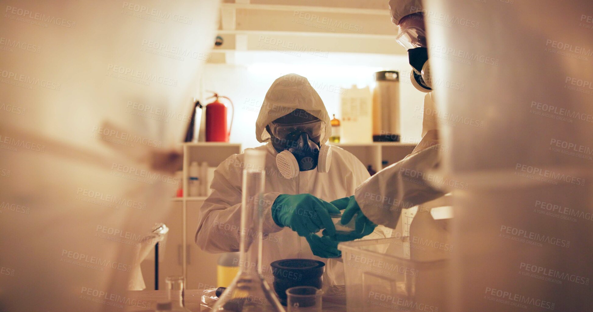 Buy stock photo Drugs, people and gas mask in lab for production of illegal substances, narcotics and crystal meth. Basement crime, hazmat suit and powder with compound mixture for cooking cocaine and manufacturing