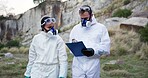 Outdoor, forensic scientist and investigation for clues, team and reading of report, nature and analysis. Crime scene, professional and people with clipboard, inspection and detective for mystery