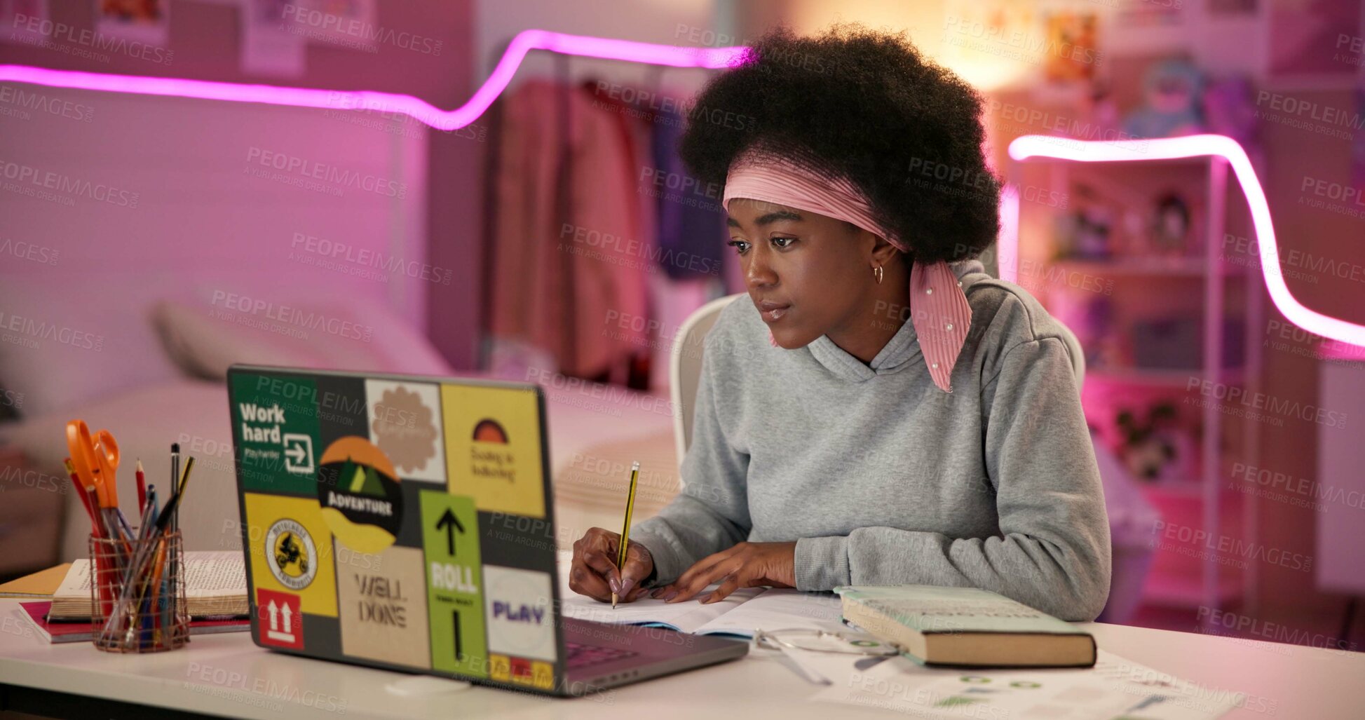 Buy stock photo Black girl, laptop and study in home for university, online course and research project with writing at night. Student, technology and learning by desk for college, education and exam notes with book