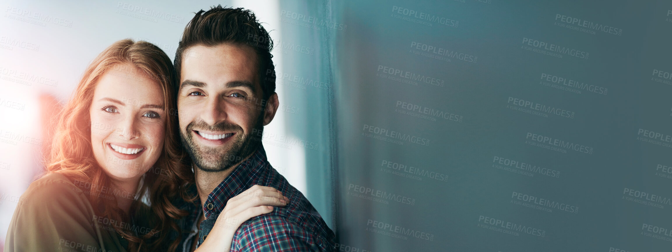 Buy stock photo Portrait of a happy young couple leaning against a blackboard