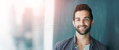 Buy stock photo Portrait of a confident young man leaning against a blackboard