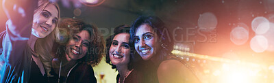 Buy stock photo Shot of a group of friends taking a selfie at a nightclub