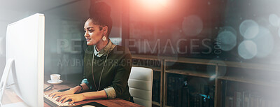 Buy stock photo Shot of an attractive young woman working on her computer in the office