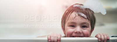 Buy stock photo Portrait of a little boy sitting in a bathtub