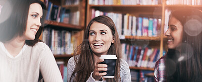 Buy stock photo Women, students and coffee break for discussion in library and relax for bonding together in university. Friends, learning or collaboration for assignment or drink cocoa for inspiration in college