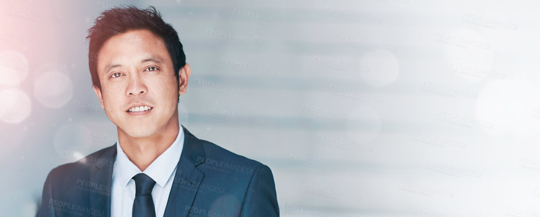 Buy stock photo Portrait of a young businessman standing in an office with colleagues in the background