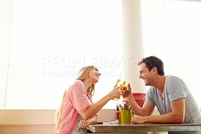 Buy stock photo Cheers, couple and date in cafe with beer, smile and romantic bonding together at table for drinks. Toast, man and woman in restaurant for weekend fun, love or relationship connection with alcohol