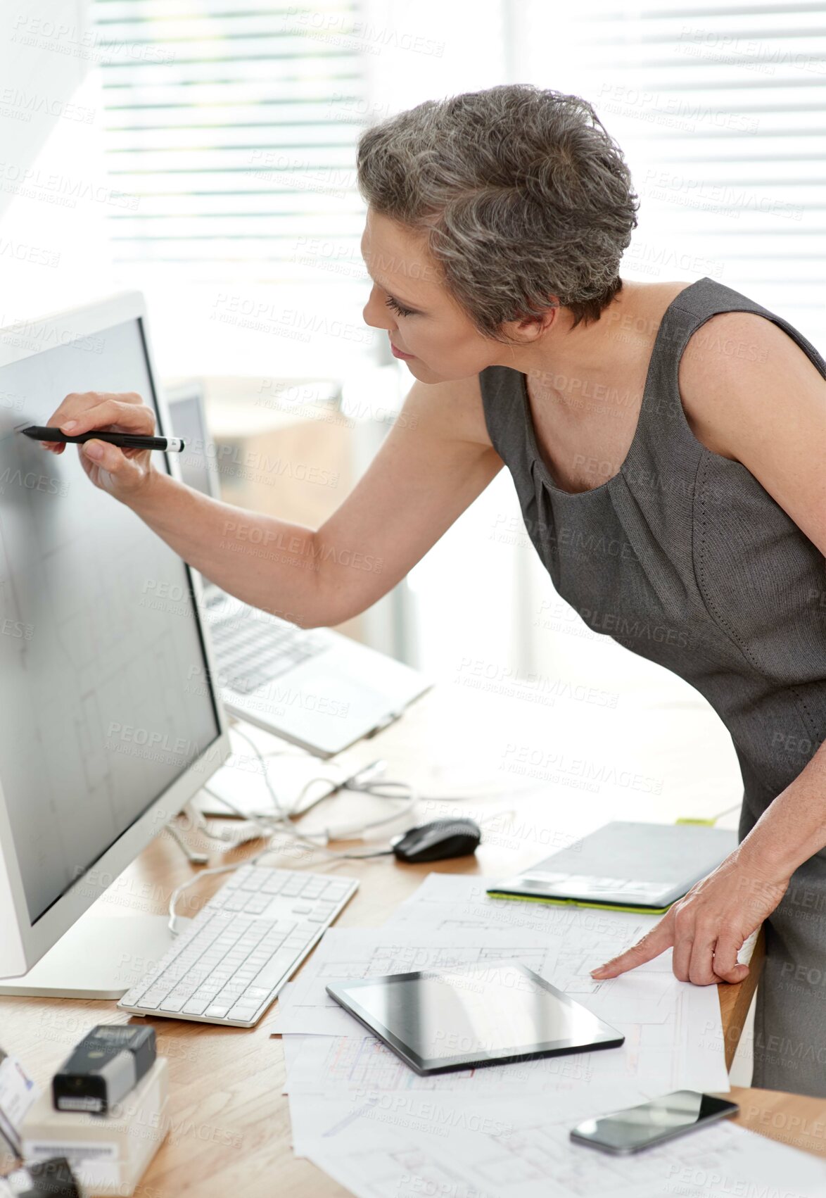 Buy stock photo Mature woman, architect and blueprint with technology for design, ideas or project in development. Female person, professional and computer as designer or creative for management in office or company