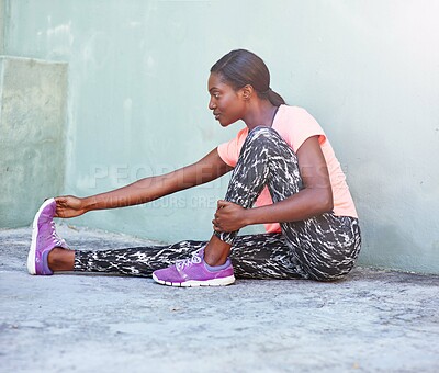 Buy stock photo Happy, black woman and stretching with foot for fitness, workout or warm up exercise on floor. Young African, female person or active runner with preparation or getting ready for training or practice