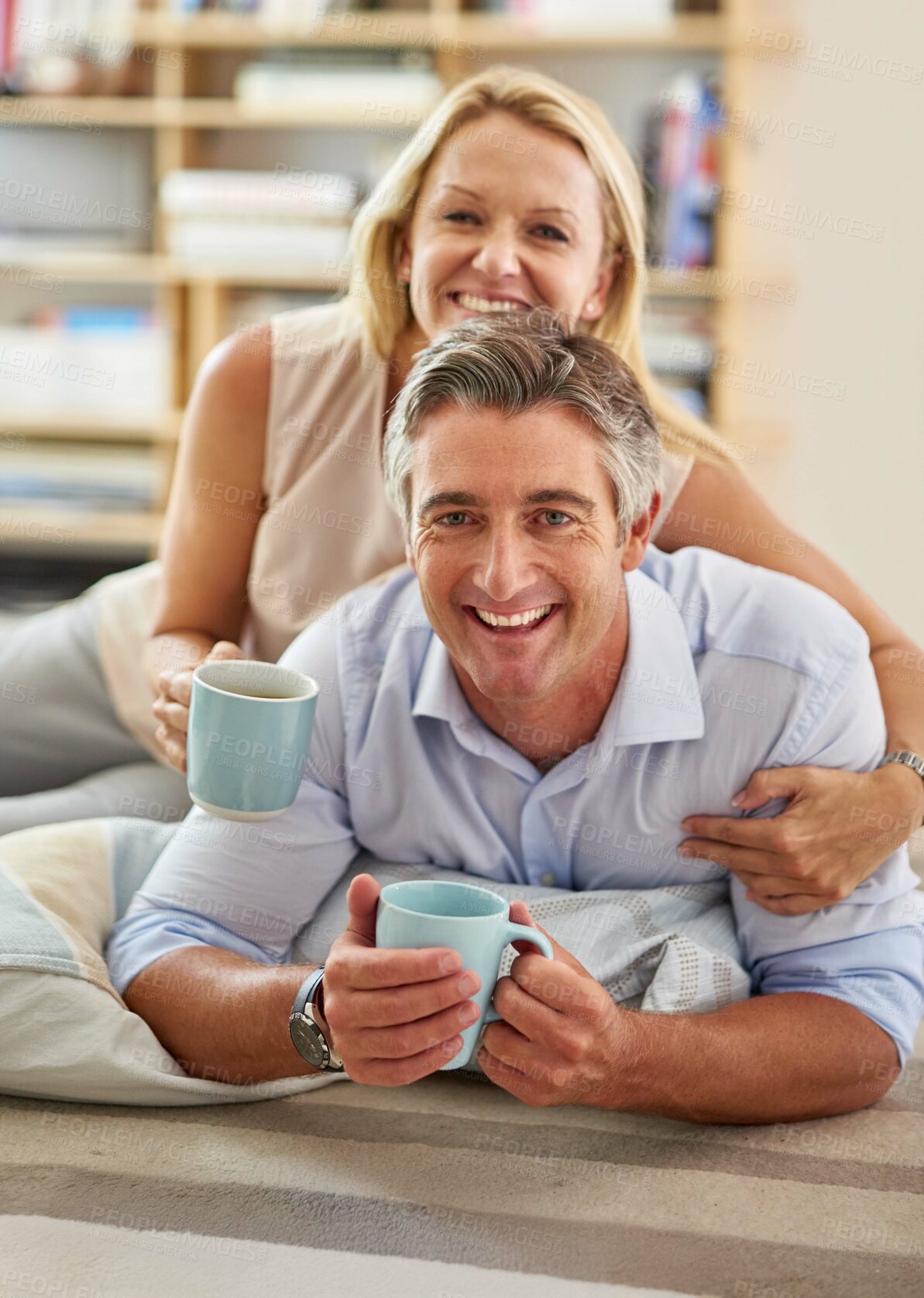 Buy stock photo Home, mature couple and portrait with smile for coffee, warm beverage and bonding together on carpet. House, man and woman with photograph for memory, commitment and healthy marriage with happiness