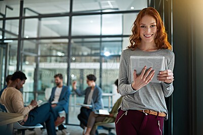 Buy stock photo Portrait of a young creative standing in an office with colleagues in the background