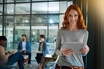 Buy stock photo Portrait of a young creative standing in an office with colleagues in the background