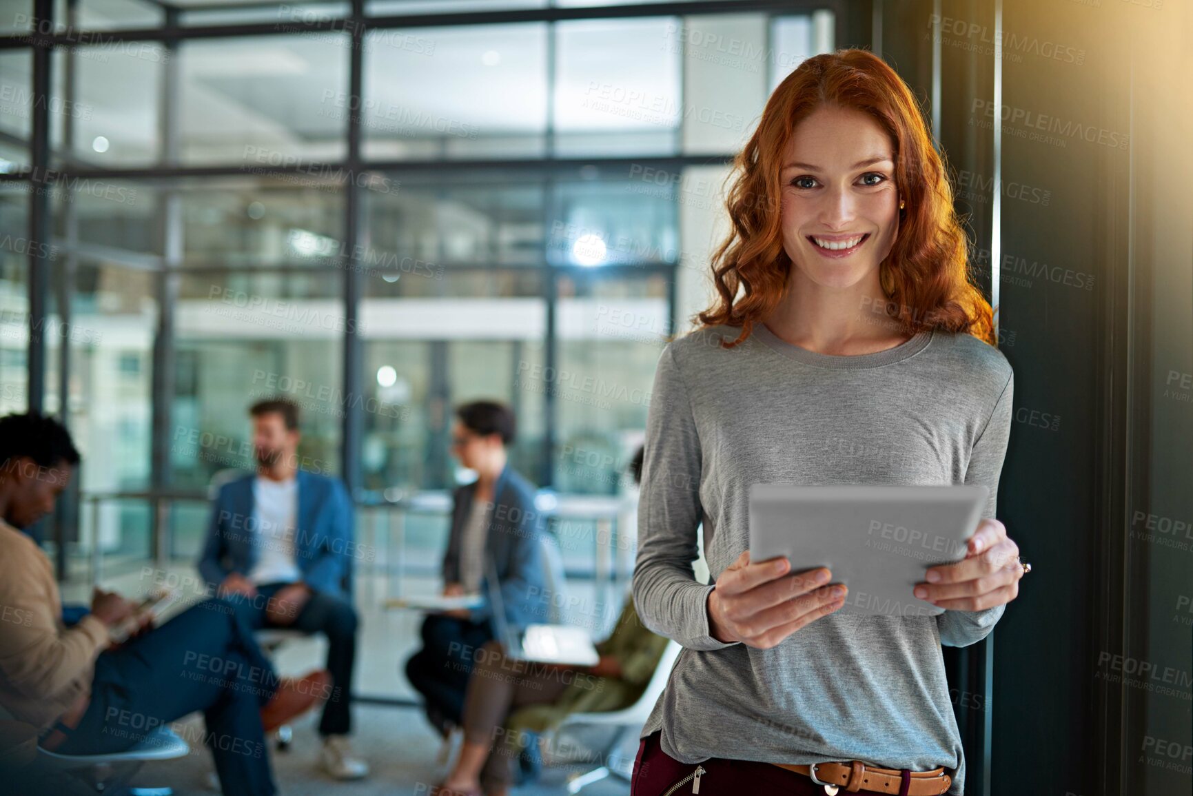 Buy stock photo Portrait of a young creative standing in an office with colleagues in the background