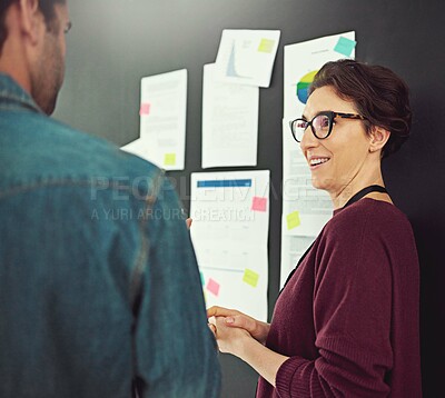 Buy stock photo Portrait of a young creative standing in an office with colleagues in the background