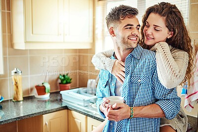 Buy stock photo Morning, coffee or happy couple hug in kitchen for love with support, smile or soulmate partner. Drinking tea, home or people bonding in relationship together for affection, romance or commitment