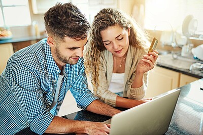 Buy stock photo Happy couple, laptop and kitchen with credit card for online shopping, payment or internet banking at home. Young, man and woman with smile, debit or computer for ecommerce or remote transaction