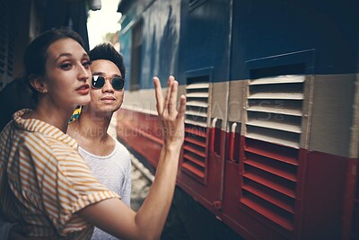 Buy stock photo Couple, travel and platform at train station in city with wave, ready or adventure on vacation in summer. People, woman and man with railway transportation, town and holiday with direction in Vietnam