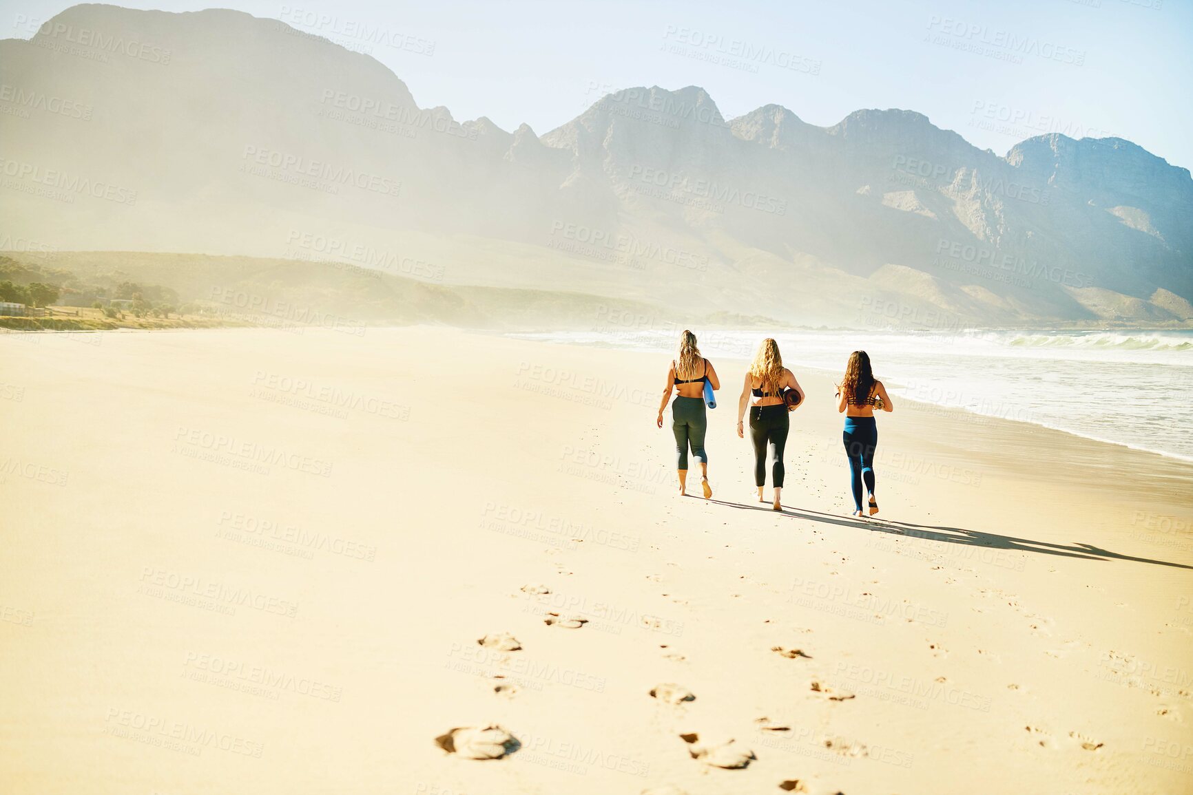 Buy stock photo Walking, yoga and back of women on beach for wellness, peace and mindfulness in nature. Morning, pilates and people by ocean for exercise, meditation and workout for health, balance and mobility