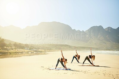 Buy stock photo Health, yoga and women on beach in morning for wellness, peace and mindfulness in nature. Friends, pilates and people by ocean for exercise, stretching and workout for strength, balance and mobility