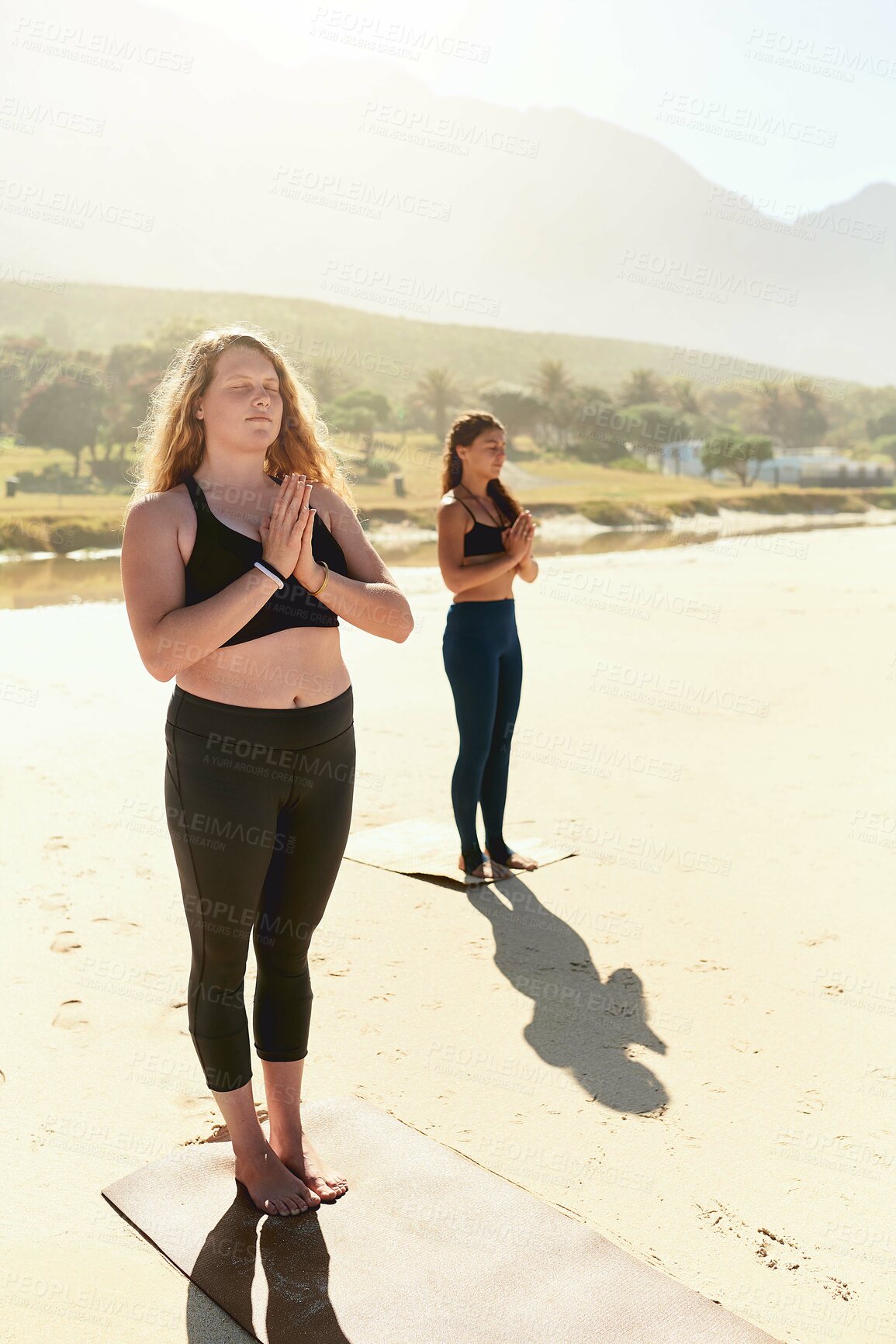 Buy stock photo Health, meditation and group of women on beach with peace, namaste or wellness for holistic care. Zen, relax and people at ocean for mindfulness, calm morning or outdoor yoga class in nature together