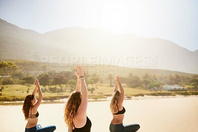 Buy stock photo Beach, class and women with namaste for meditation, wellness or inner peace for mindfulness outdoor. Nature, people or instructor with prayer hands for yoga, mental health or holistic energy by flare