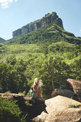 Buy stock photo Woman, mountain and rock for hiking, thinking or tropical holiday outdoor with peace on weekend break. Female person, vision and travel for relax, trip and vacation with sunshine, wind or mindfulness