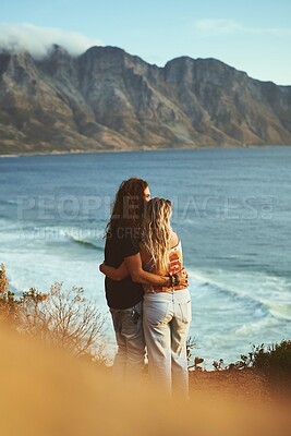 Buy stock photo Ocean, mountain and couple with hug on adventure, travel vacation and bonding together with love embrace. Outdoor, man and woman by back for anniversary, connection or holiday with affection by view