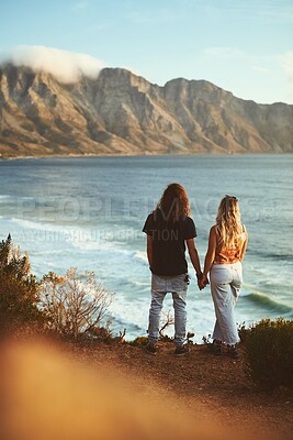 Buy stock photo Couple, mountain and back for love, holding hands and tropical holiday with romance on weekend break. Man, woman and ocean view for relax, travel and vacation with valentines day, date and support