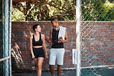 Buy stock photo Happy, fitness and talking with interracial couple on court for sports training, health and teamwork. Workout, personal trainer and exercise with man and woman for wellness, summer and performance