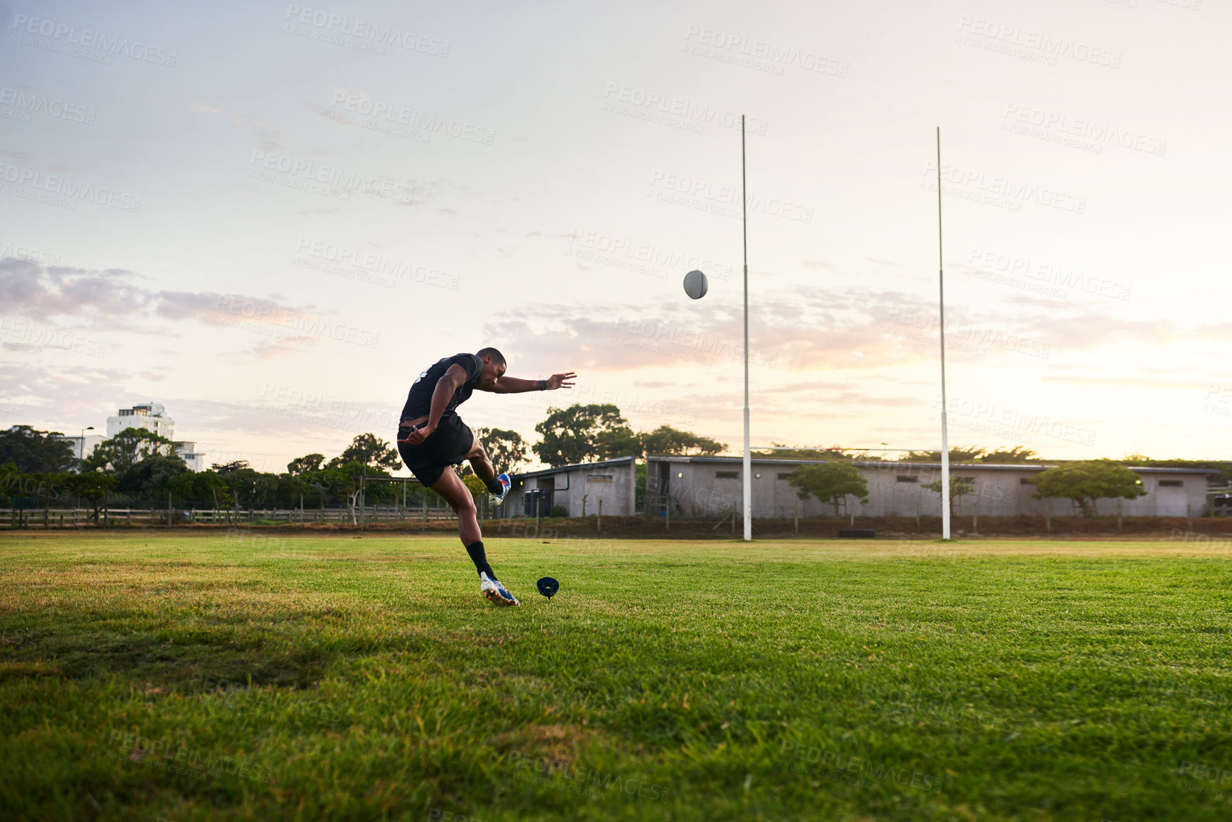 Buy stock photo Rugby, man and kick in stadium, outdoor and performance for game, match and player for competition. Professional, field and person with goals, campion and fitness of athlete, mockup and football