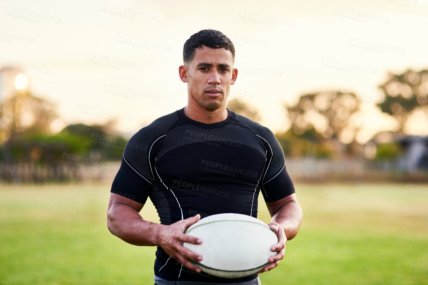 Buy stock photo Man, portrait and rugby with ball for outdoor, game or challenge in exercise, wellness and fitness. Male person, athlete and recreation facility in arena for match, sports and training in new zealand