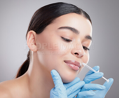 Buy stock photo Hands, injection and woman with plastic surgery lip filler for beauty on studio background. Collagen, syringe and face lift process in clinic with patient closeup or antiaging cosmetics treatment