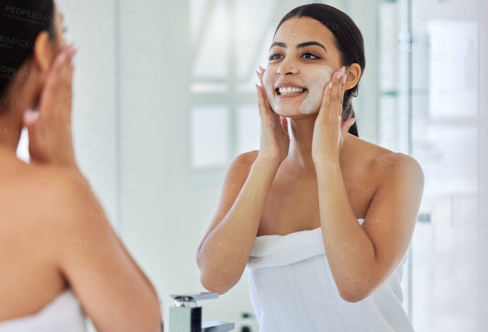 Buy stock photo Beauty, lotion and mirror with woman in bathroom of home for morning skincare routine or wellness. Cream, reflection and smile of happy person in towel at apartment for facial dermatology treatment