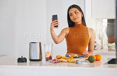 Buy stock photo Woman, selfie and smoothie nutrition in home, cooking and fruit for mineral liquid in kitchen. Female person, photography and online for social media update on diet, breakfast post and blender detox