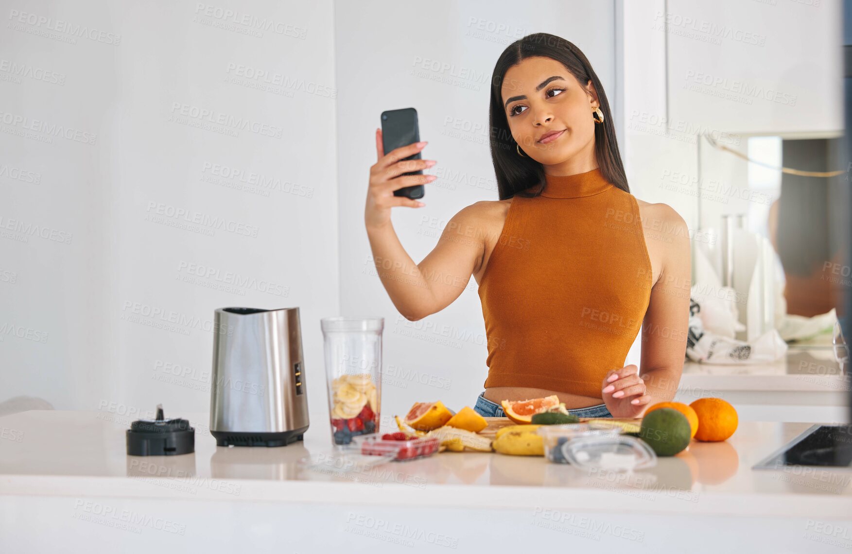 Buy stock photo Woman, selfie and smoothie nutrition in home, cooking and fruit for mineral liquid in kitchen. Female person, photography and online for social media update on diet, breakfast post and blender detox