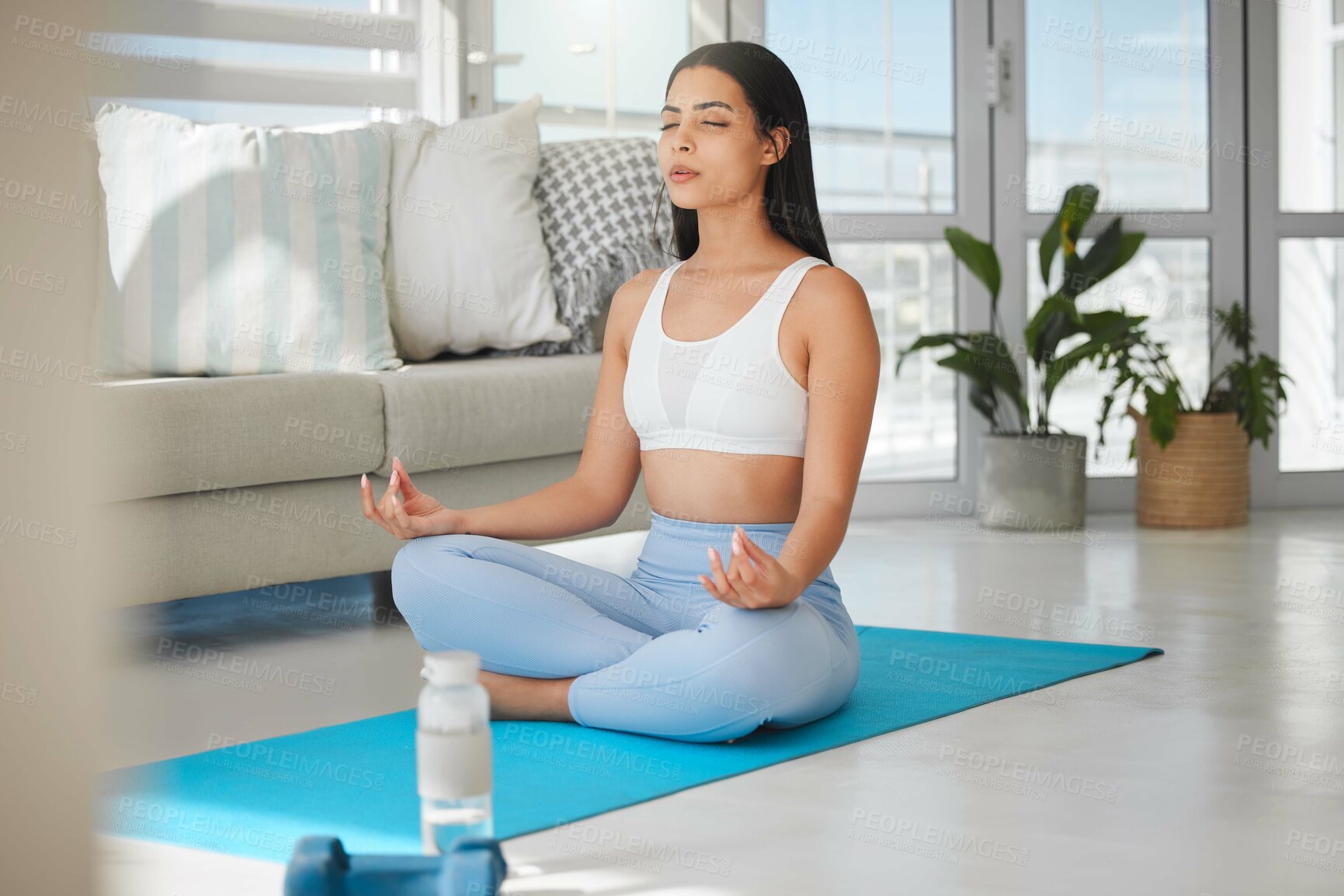 Buy stock photo Yoga, woman and lotus in home for meditation, peace and wellness on mat. Fitness person, zen and healthy body in living room for spiritual healing, positive mental health and calm to align chakra