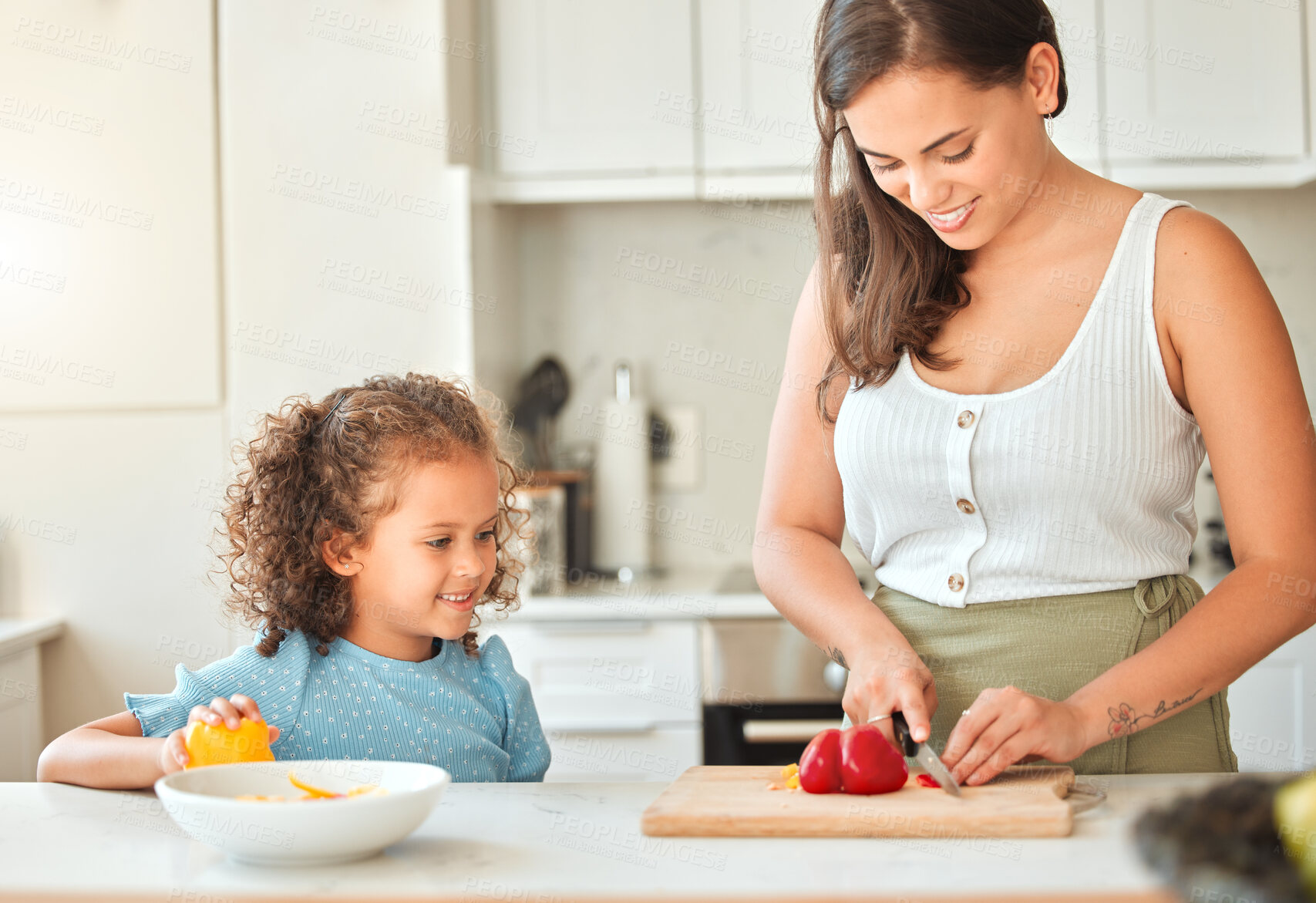 Buy stock photo Mother, child and teaching with smile, help and guidance for cooking and chopping in kitchen. Woman, girl and learning to cut vegetables for dinner, meal and healthy diet with fun bonding at home