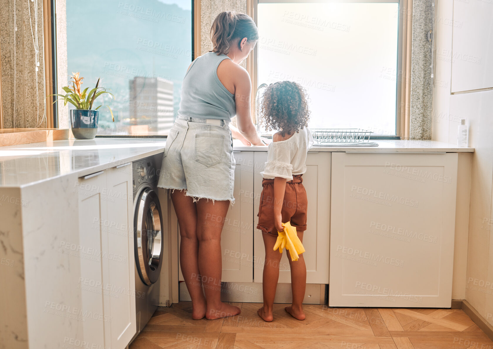 Buy stock photo Woman, kid or washing dishes in kitchen for help, learning or responsibility development in home. Back, mom or daughter at sink for cleaning, bacteria prevention or teaching chores for child growth