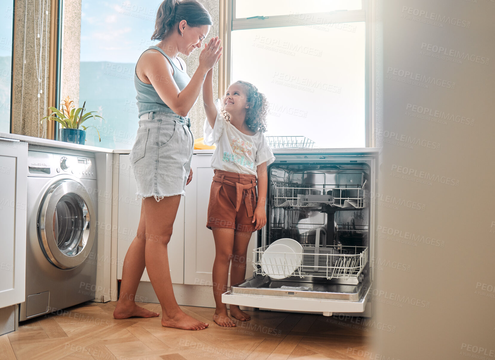 Buy stock photo Mother, kid or dishwasher in kitchen with high five, learning or smile for responsibility development. Woman, girl or pack appliance in home for hygiene, good job or teaching chores for child growth