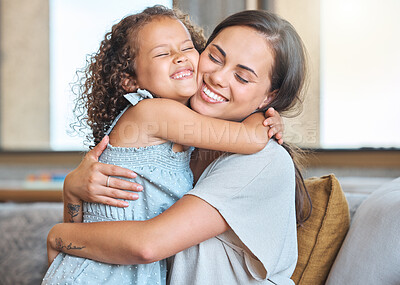 Buy stock photo Hug, smile and mom on sofa with child for morning bonding, gratitude and support in fun family home. Love, mother and daughter on couch with happy embrace, care and connection in living room together