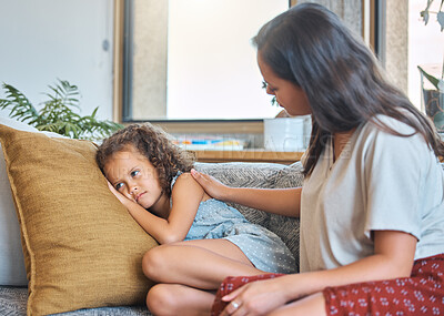 Buy stock photo Mother, child and sad on sofa with support, empathy and comfort in home. Woman, daughter and anxiety in living room for loss, grief counseling and affection with care for mental health development