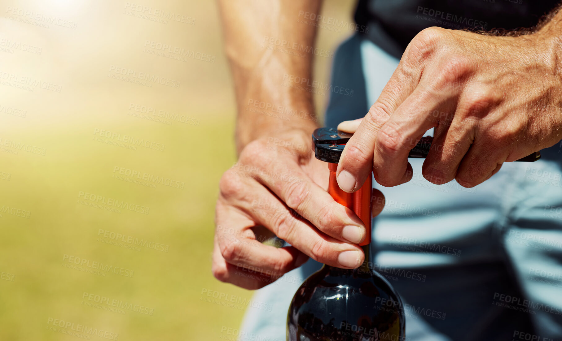 Buy stock photo Outdoor, opening and hands with wine, bottle and server for alcohol tasting, event and nature of vineyard. Environment, luxury and person with drink, sommelier and expert in farm, testing or business