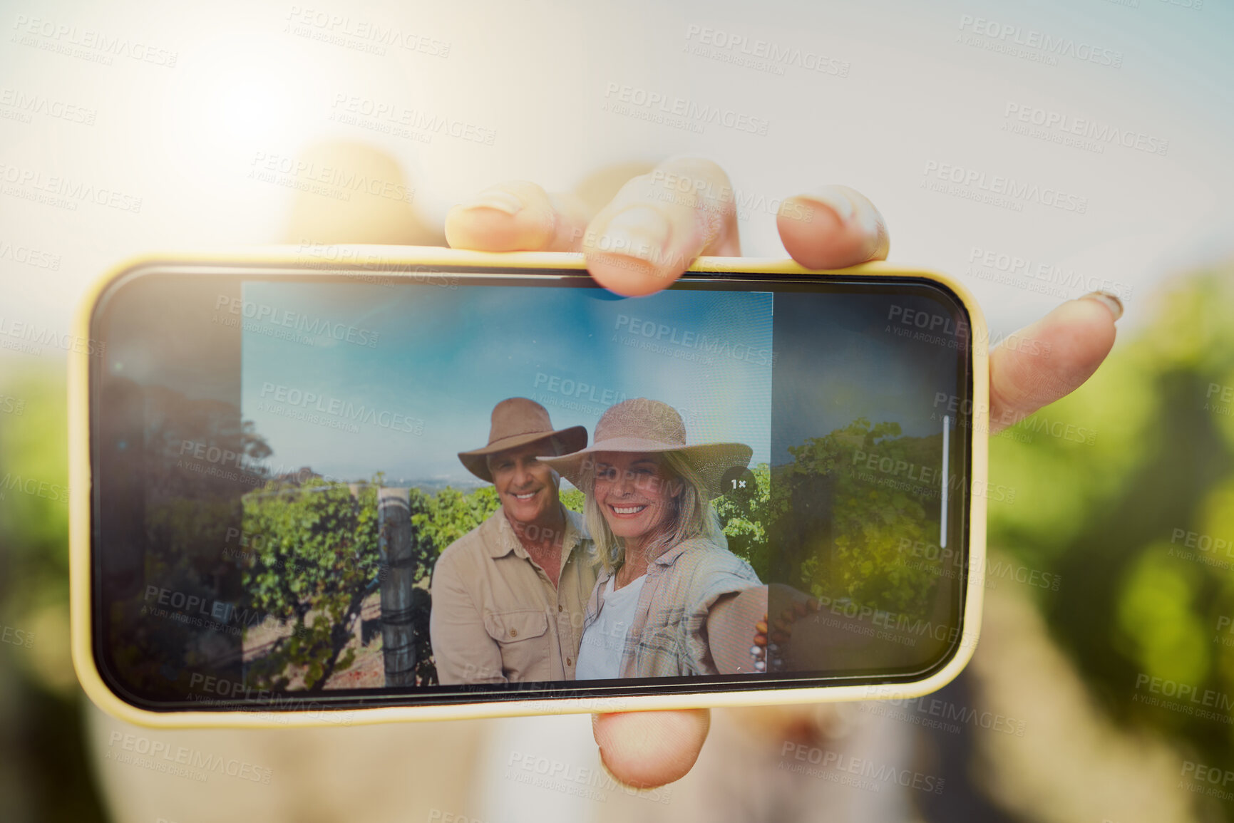 Buy stock photo Phone screen, hand and selfie of happy couple at vineyard for vacation, holiday or travel closeup. Senior man, woman and picture at winery farm with mobile for memory or photo on date by grape field