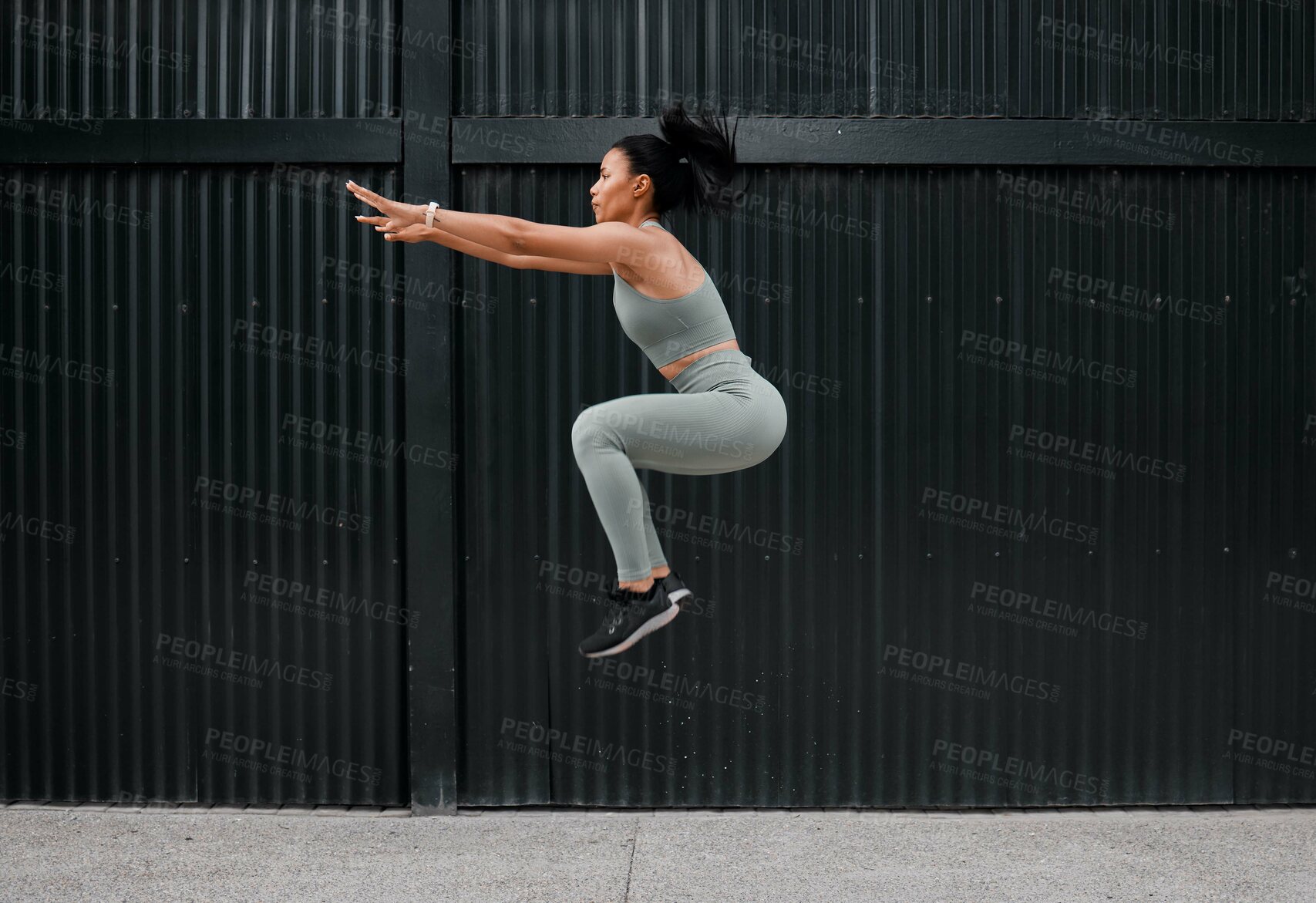 Buy stock photo Athlete, woman and jumping for exercise outdoor with fitness, sports training and energy of health workout. Active, girl and leap with cardio performance, endurance progress and competition practice